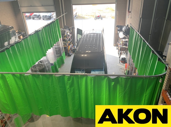 Heavy duty industrial curtains slide out-of-the-way