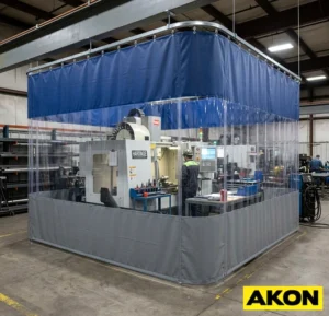 Industrial curtain wall enclosure dividing a large warehouse or factory floor into separate work areas.