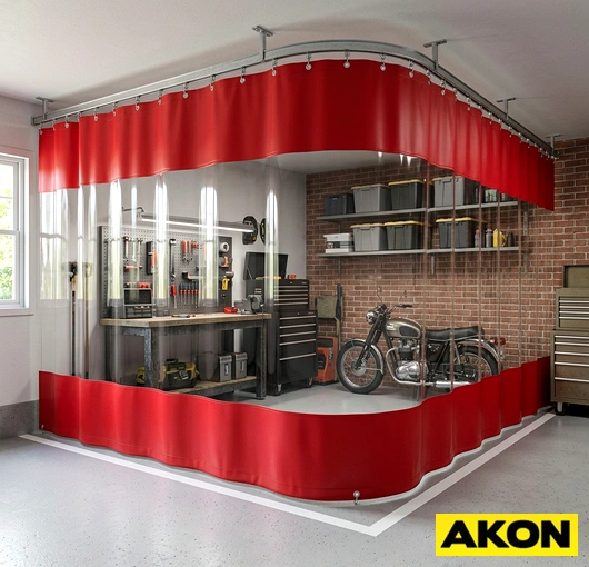 Heavy-duty curtains enclosing a garage workspace to separate it from surrounding areas.