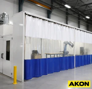 Industrial curtain enclosing a prep station work area to separate it from surrounding floor space.