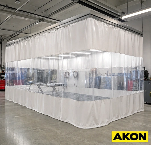 Protective curtains enclosing a prep booth in an industrial spray or finishing area.
