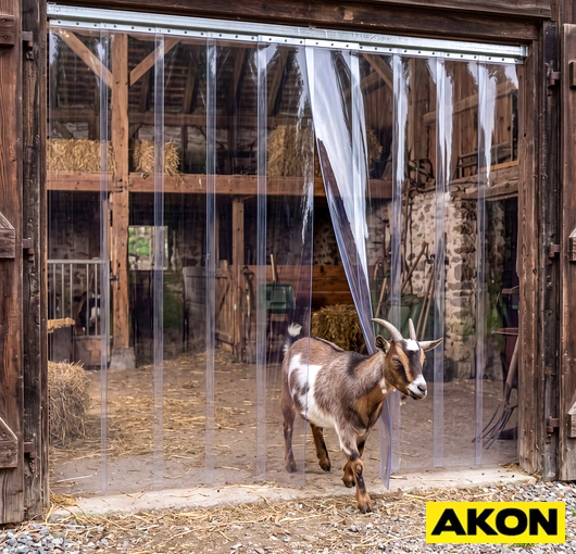 Strip curtain installed at a livestock facility entrance used to contain goats while allowing easy passage.
