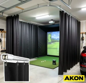 Heavy blackout drapes installed in a golf simulator room to block ambient light and enclose the hitting bay.