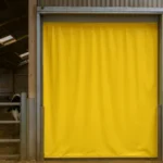 Climate control in barns and animal facilities using a bright yellow industrial curtain wall to maintain temperature and protect livestock inside a modern barn