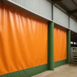 Climate control in barns and animal facilities using industrial curtain walls to regulate temperature and protect livestock in a modern barn setting