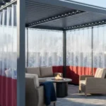 Backyard patio with string lights and Roll-up Clear Patio Curtains – Keep Your View in Winter, creating a festive and warm winter retreat
