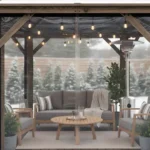 Cozy winter gazebo with clear vinyl enclosures, showing how Gazebo Winter Walls Best Options for Wind, Rain, and Cold keep furniture and seating areas protected in snowy weather