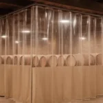 Curtain Walls for Wine Cellars or Barrel Aging Rooms in Shared Warehouses creating a climate-controlled section with stacked wine barrels, ideal for micro-wineries and hobby vintners