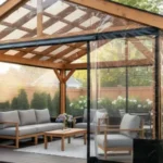 Gable-style pergola enclosure with black-trim vinyl curtains around a lounge area – Pergola Enclosures vs. Permanent Walls – Flexibility and Resale Value