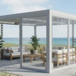 Glass-like pergola enclosure with sliding vinyl panels by the beach, offering protection for coastal climates focused on salt, wind, and care