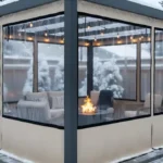 Louvered pergola fully enclosed with tan-trim vinyl panels in snowy backyard – Winterizing a Louvered Pergola – What Works and What to Avoid