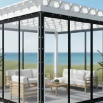 Modern pergola enclosure with black-trim clear vinyl panels, built for coastal climates with reliable salt, wind, and care performance
