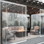 Pergola with transparent vinyl covers blocking snow and wind – Winterizing a Louvered Pergola – What Works and What to Avoid
