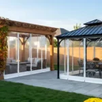 White-trim zippered door panels for pergolas and gazebos, illustrating how enclosures protect outdoor spaces while maintaining a bright and open feel