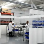 White vinyl curtain walls enclose quality control area for inspections, providing a clean and flexible inspection environment in a factory setting
