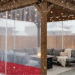 Wooden pergola with red-bottom clear vinyl side panels providing winter protection – Pergola Side Panels Temporary Winter Solutions That Look Built-In