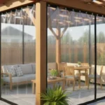 Wooden pergola with transparent vinyl panels enclosing a dining set – Pergola Enclosures vs. Permanent Walls – Flexibility and Resale Value