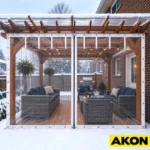 Clear vinyl roll-up curtains installed on a covered patio to enclose the space while maintaining visibility.