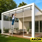 A manual hand roll patio shade installed on an outdoor patio to block sunlight and provide privacy.