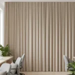 Echo Reducing Curtains installed in an office space with desks and computers to improve privacy and reduce noise