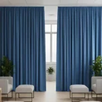 Echo Reducing Curtains providing acoustic control in a bright waiting room with seating and indoor plants