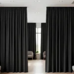 Echo Reducing Curtains used as room dividers in a modern waiting area with sofas and natural light