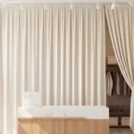 Modern retail store using Retail Storage & Clutter-Hiding Curtains to conceal backroom space behind a sales counter