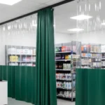 Retail Storage & Clutter-Hiding Curtains used in a pharmacy to organize shelves and keep storage areas hidden