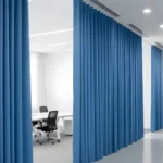 Blue Fabric Hallway Divider Curtains dividing a large office space, offering both function and a pop of color to the workspace
