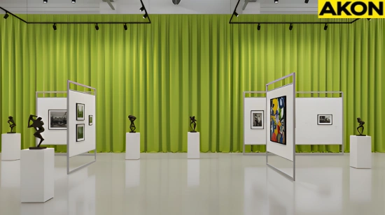Bright green museum exhibit divider curtains creating a backdrop for framed art and sculptures in a modern gallery