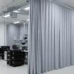 Gray curtain panels forming clean, flexible testing zones in an electric vehicle research la