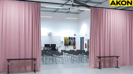 Pink training curtains forming a wide entry to an indoor safety classroom, used to separate space for confined-space training demonstrations