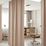 Poly Stretch Fabric Enclosure Curtains in a therapy room, providing privacy and noise control for a calm setting