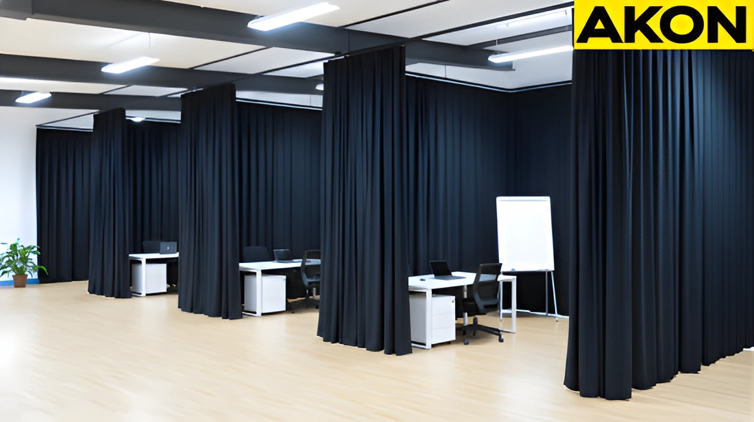 Black partition curtains used to separate work zones in a large open office