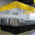 Clear vinyl industrial curtain wall used to separate retail inventory in a loft-style showroom