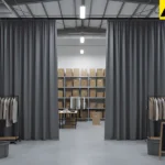 Dark fabric curtains concealing staff-only inventory and staging space behind a pop-up retail display