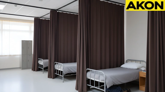 Dark fabric curtains providing privacy between beds in shared living quarters
