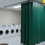 Fabric curtains dividing individual laundry stations in a residential building
