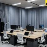 Gray curtains concealing AV equipment in a modern conference room
