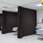 Clear vinyl curtain walls enclosing a temporary medical testing and screening areas