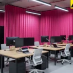 Pink fabric curtains hiding server racks in a technical control room