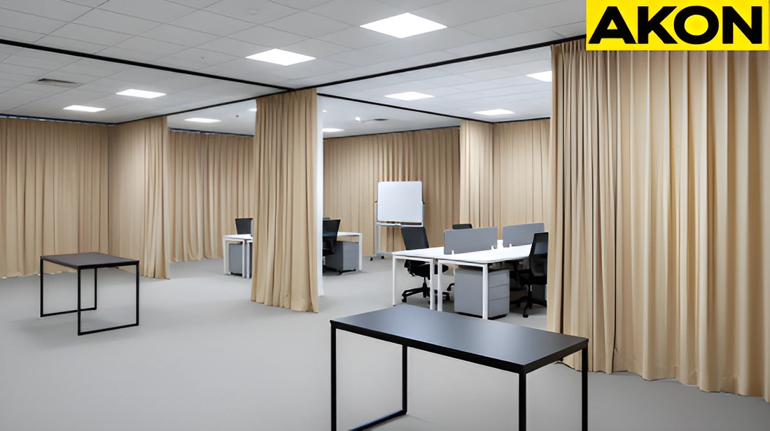 Temporary office buildout using fabric partition curtains for flexible layouts