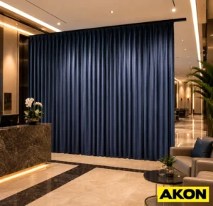 Retractable curtain system installed in a commercial lobby, shown in a partially extended position across an open entryway.