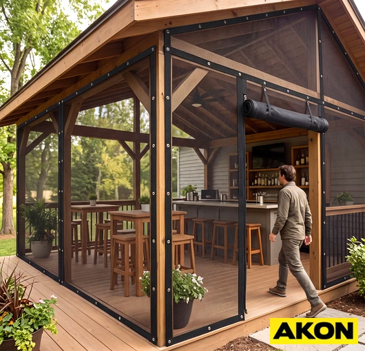 A roll-up bug screen door installed on an outdoor deck or pavilion opening to block insects while allowing airflow.